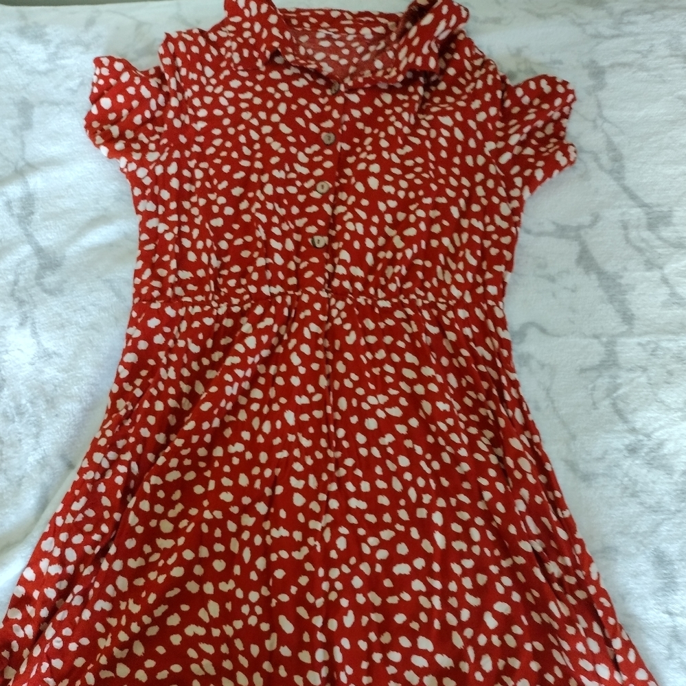 Red and white polka dot dress.